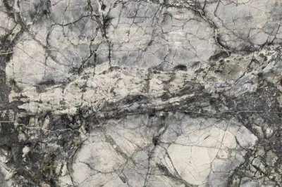 Why does natural marble stone appear weathering?